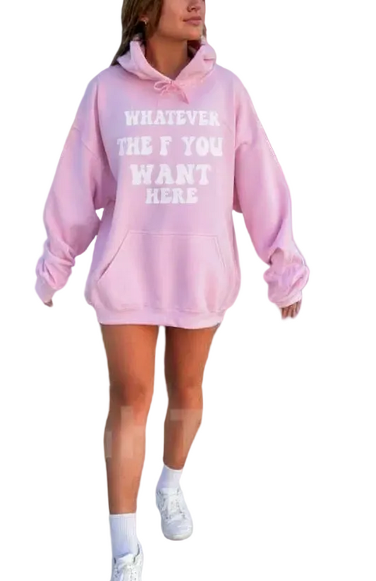 Person wearing a pink oversized hoodie with text on a pink background
