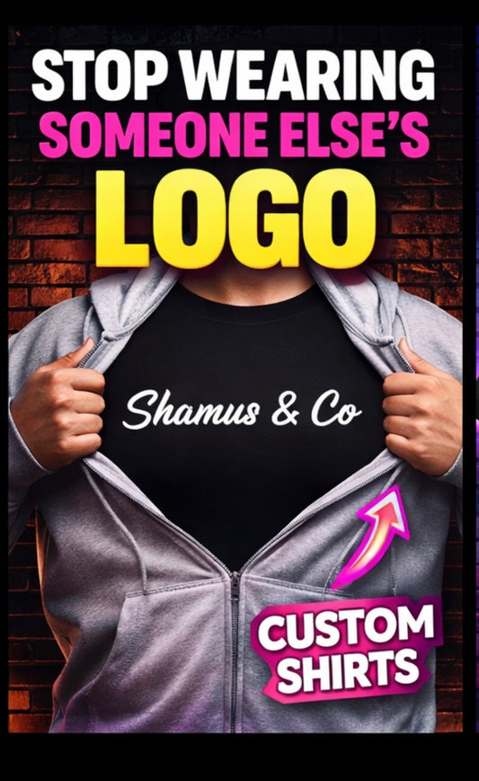 Person opening a gray hoodie to reveal a black shirt with 'Shamus & Co' text, against a brick wall background.