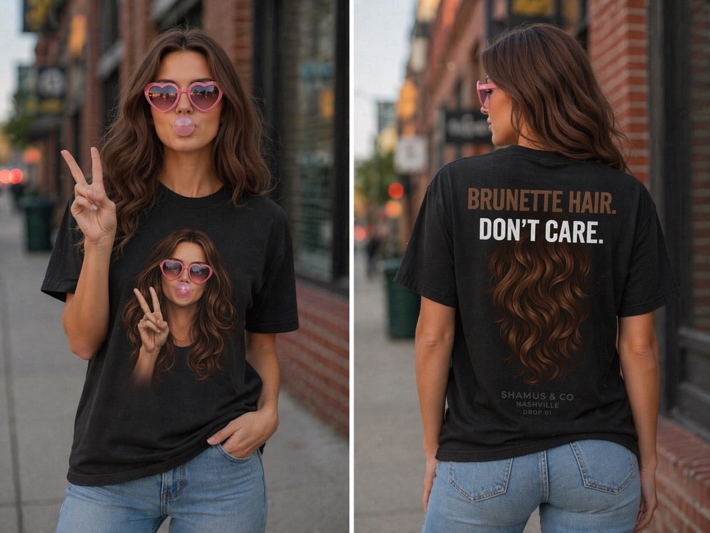 Shamus & Co brunette hair don’t care adult T-shirt with bold printed text on white fabric, casual and stylish graphic tee.