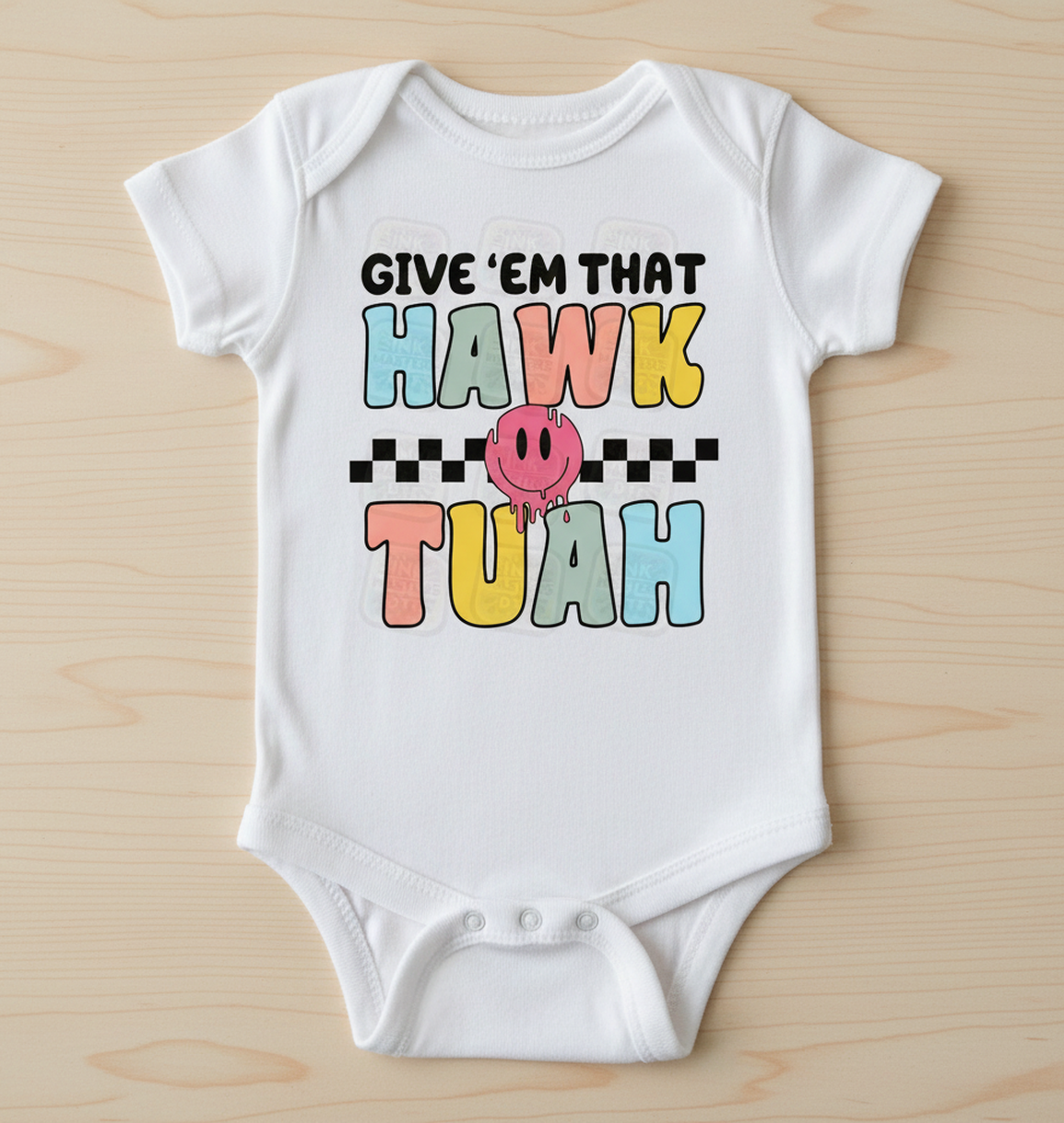 Shamus & Co Hawk Tuah baby bodysuit in soft fabric, featuring playful design and snap closures for easy dressing.