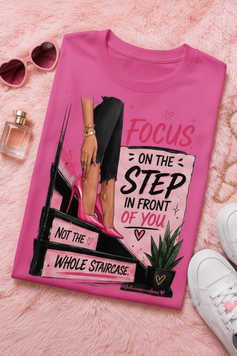 White adult T-shirt by Shamus & Co featuring a motivational "Focus On The Step" graphic for women.