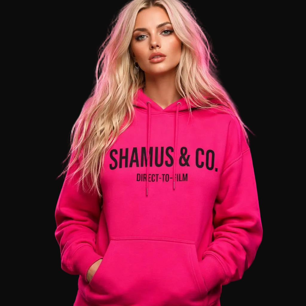 Person wearing a pink hoodie with 'SHAMUS & CO.' text against a pink smoke background