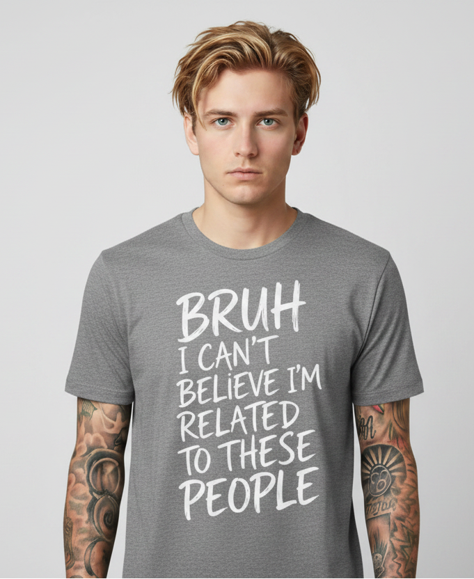 Man wearing a gray t-shirt with text on a plain background