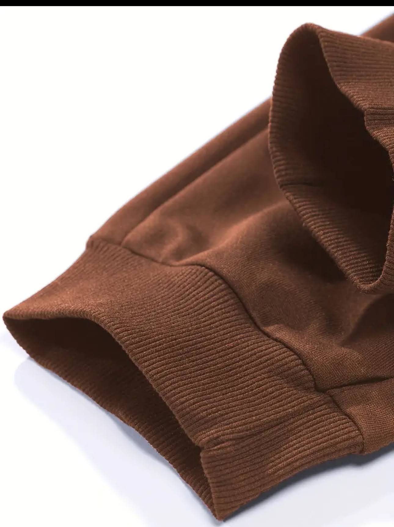 Brown knitted sweater sleeve on a white background