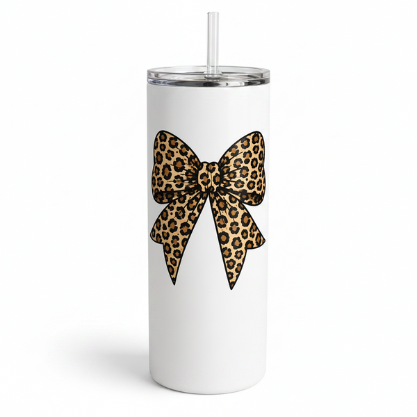Tumbler with a leopard print bow design on a beige background