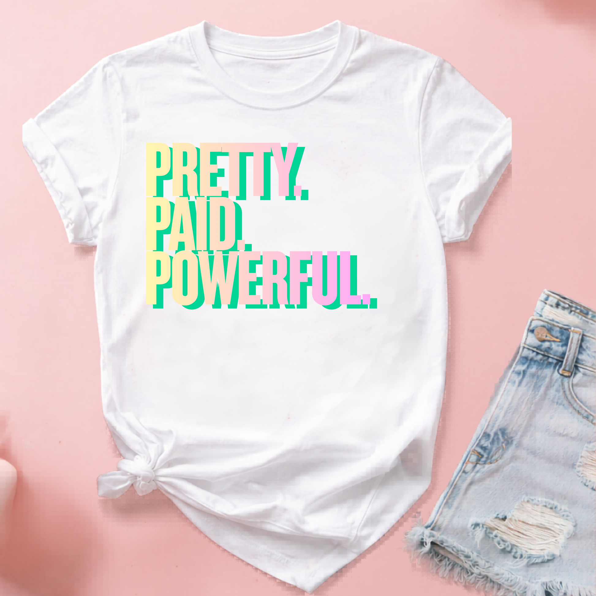 Pink graphic T-shirt for adults with "Pretty Paid Powerful" slogan by Shamus & Co, featuring a trendy, vibrant design.